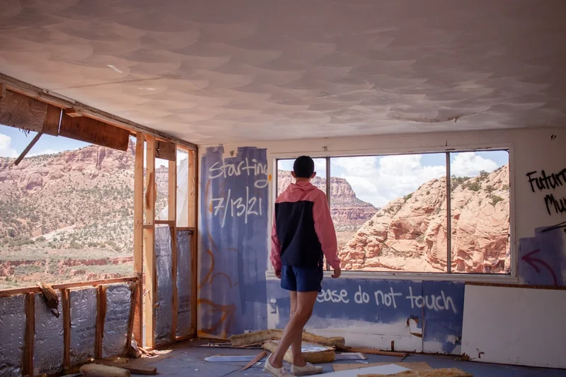 a man standing in front of a building